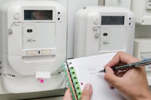 Man notes the meter reading